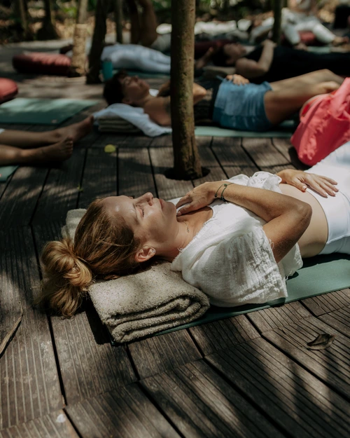 Women in savasana during retreat