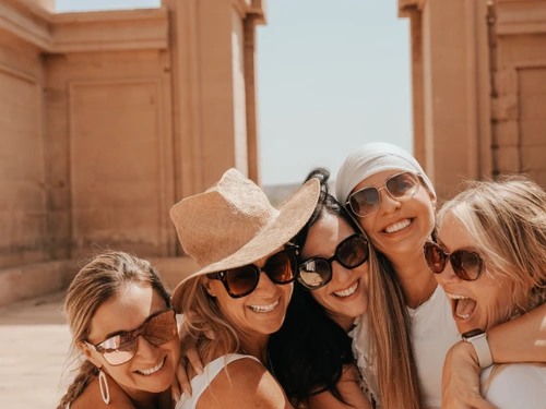 Women embracing at temple ceremony